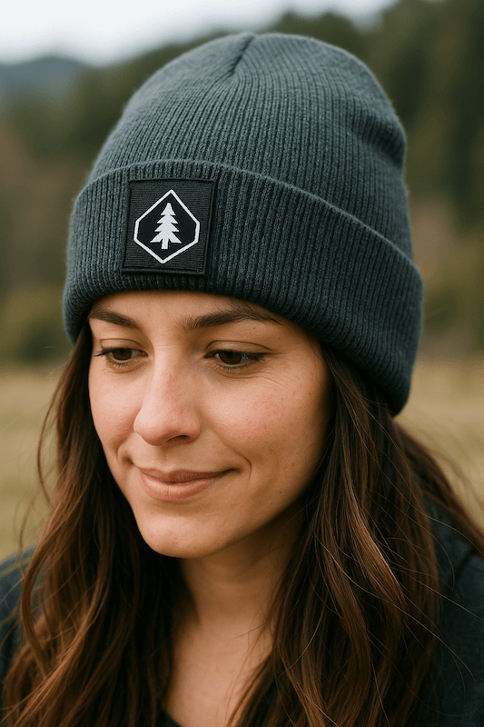 woman wearing green beanie with woven label