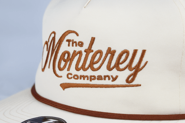 white hat with brown Monterey embroidery