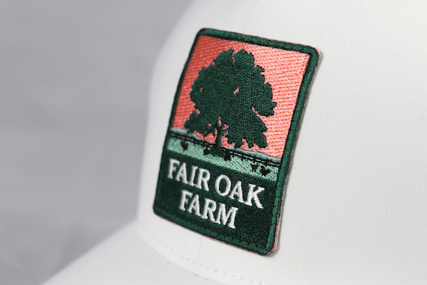 embroidered patch on white hat